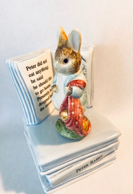 Vintage Peter Rabbit Rotates in front of Book