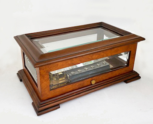 Five sided beveled glass windows in elm and walnut cabinet