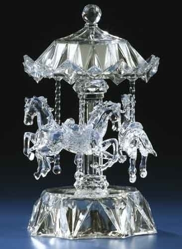 crystal clear acrylic carousel with three horses