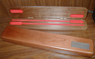 Mollard conductor's baton cases in Walnut and Cherry.