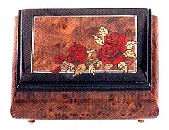 Elm musical box with walnut border and roses on corner