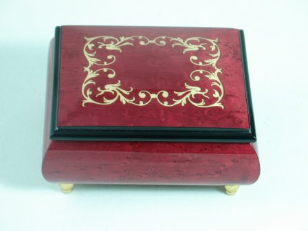 A beautiful elm music box with Italian Inlaid barogue scroll frame on lid