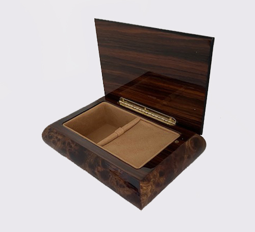 Interior view of burl elm music box with baroque border