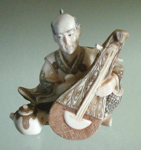 Tiny Mammoth Tusk Ivory Male Musician