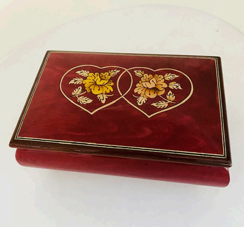 Italian inlay of linked hearts on wine red music box