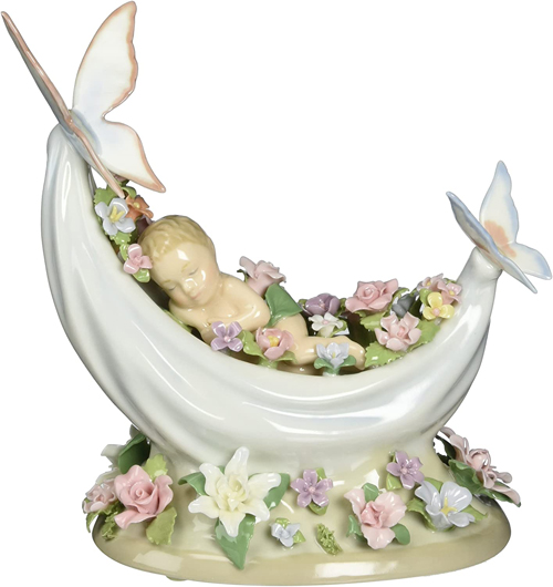 musical figurine of sleeping fairy in flower filled boat