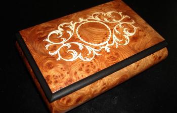 elm music box with scroll work