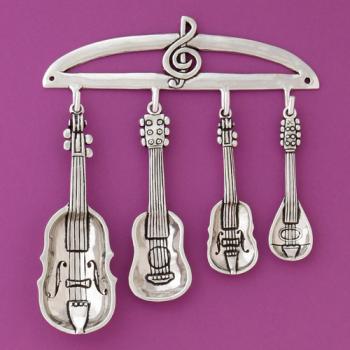est of four stringed instrument spoons and rack