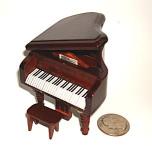 Small miniature baby grand piano in  Brown
