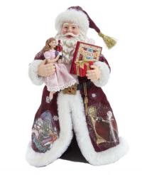 Santa, dressed in Fabric, holding Clara with her Nutcracker.