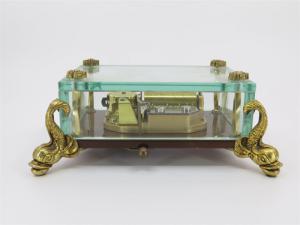 The Reuge Dauphin 1.36 note Crystal Music Box with brass dolphin feet