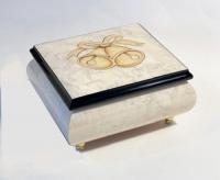 white musical box with inlay of golden bells