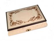 White finished musical box with golden baroque border