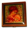 An Edna Hibel Decoupage of a mother and daughter graces the lid of this mahogany music box.