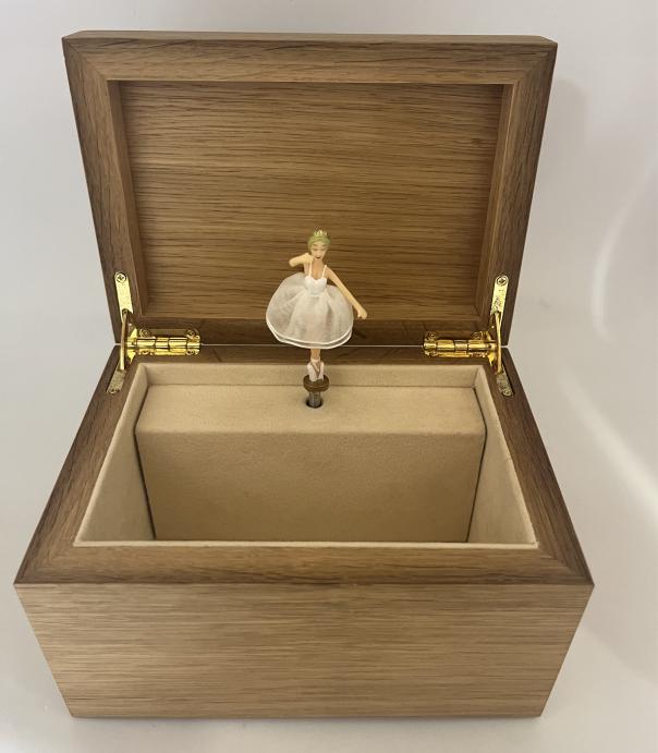 ballerina dances inside box