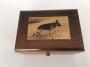 engraved image of German Shepherd on music box