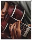 A Close Up of Hands on a Guitar 