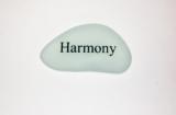Harmony engraved on small Sea Glass  