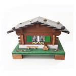 Swiss Chalet music box with bench and logs
